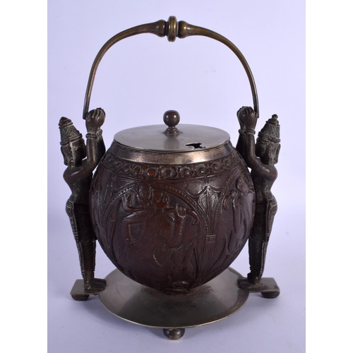 308 - A VERY RARE 19TH CENTURY INDIAN CARVED COCONUT SHELL BOWL AND COVER with two standing Buddhistic bro... 