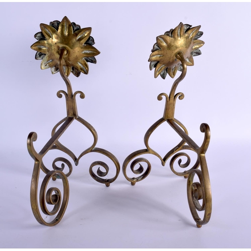 309 - A PAIR OF ARTS AND CRAFTS BRONZE FIRE SIDE ANDIRONS of floral form. 34 cm x 22 cm.