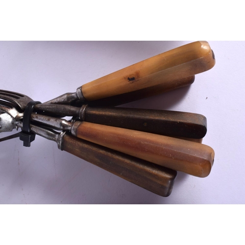 310 - A SUITE OF 19TH CENTURY CONTINENTAL CARVED RHINOCEROS HORN CUTLERY with steel mounts. (qty)