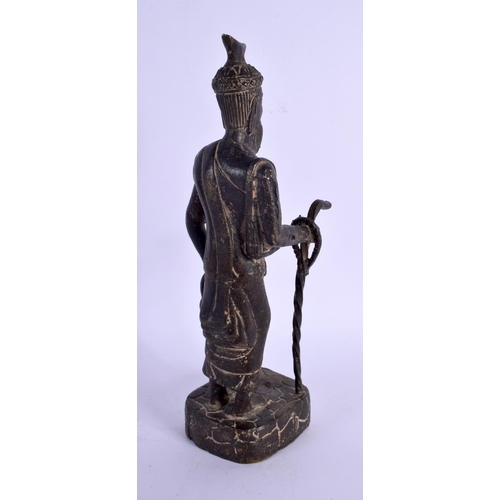 318 - AN 18TH/19TH CENTURY MIDDLE EASTERN BRONZE FIGURE OF A MALE modelled holding a teapot and staff. 24 ... 