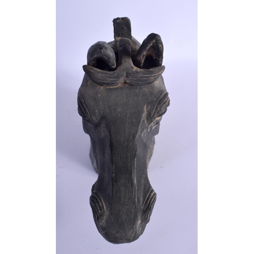 329 - A CHINESE QING DYNASTY BLACK PAINTED POTTERY HEAD OF A HORSE modelled in the Han Dynasty style. 30 c... 