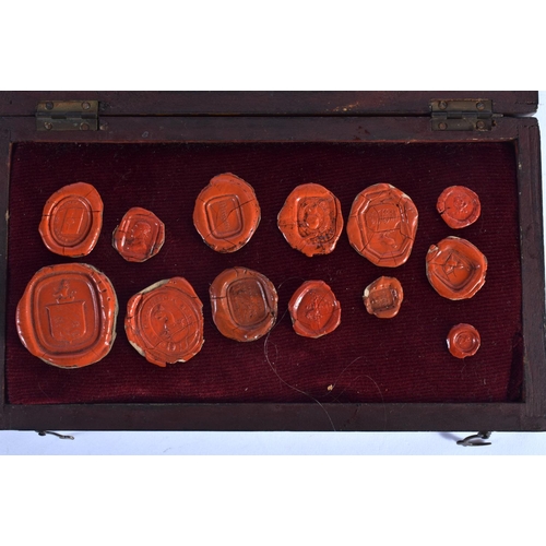 333 - AN ANTIQUE CASED SET OF WAX SEALS. Box 18 cm x 11 cm. (qty)