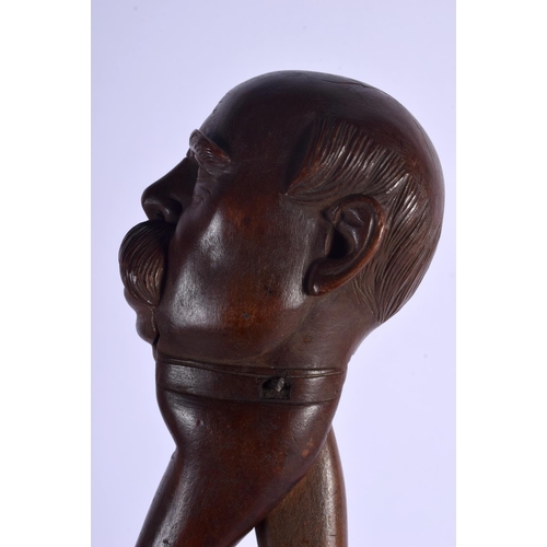 334 - A PAIR OF ANTIQUE BAVARIAN BLACK FOREST NUT CRACKERS. 21 cm x 7 cm.