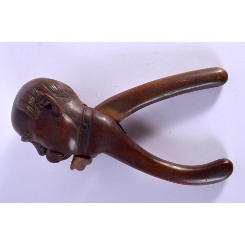 334 - A PAIR OF ANTIQUE BAVARIAN BLACK FOREST NUT CRACKERS. 21 cm x 7 cm.