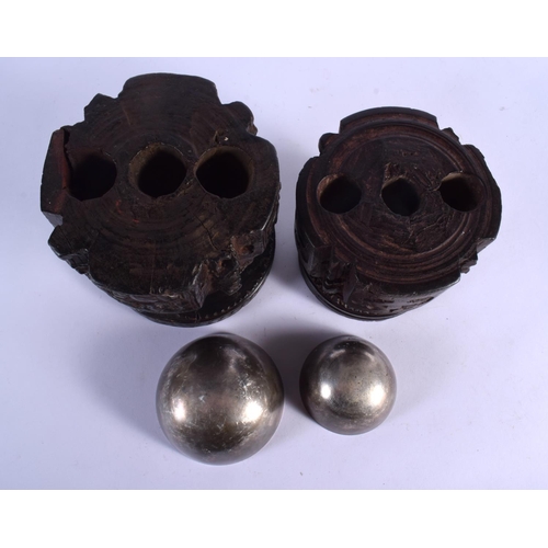 339 - A RARE NEAR PAIR OF 17TH/18TH CENTURY INDIAN CARVED WOOD MORTARS carved with Buddhistic figures. Lar... 
