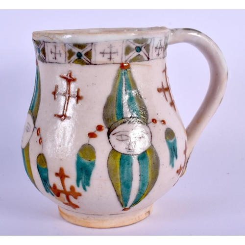 34 - AN OTTOMAN TURKISH KUTAHYA HOLY WATER CUP painted with figures. 9 cm x 9 cm.