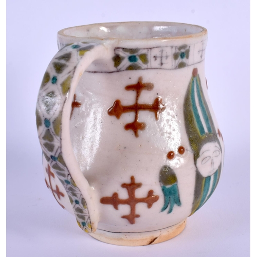 34 - AN OTTOMAN TURKISH KUTAHYA HOLY WATER CUP painted with figures. 9 cm x 9 cm.