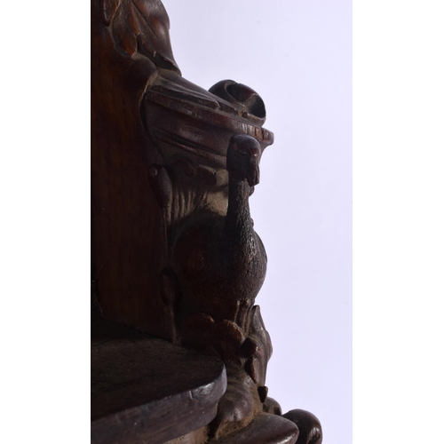 341 - AN UNUSUAL ANTIQUE BLACK FOREST TYPE HANGING WALL FONT STYLE STAND formed with owls and birds. 50 cm... 