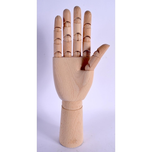345 - A CONTEMPORARY CARVED WOOD ARTICULATED LAY TYPE RING DISPLAY in the form of a hand. 30 cm high exten... 