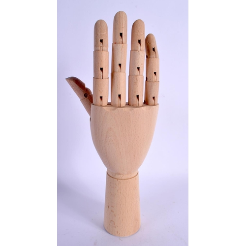 345 - A CONTEMPORARY CARVED WOOD ARTICULATED LAY TYPE RING DISPLAY in the form of a hand. 30 cm high exten... 