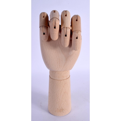 345 - A CONTEMPORARY CARVED WOOD ARTICULATED LAY TYPE RING DISPLAY in the form of a hand. 30 cm high exten... 