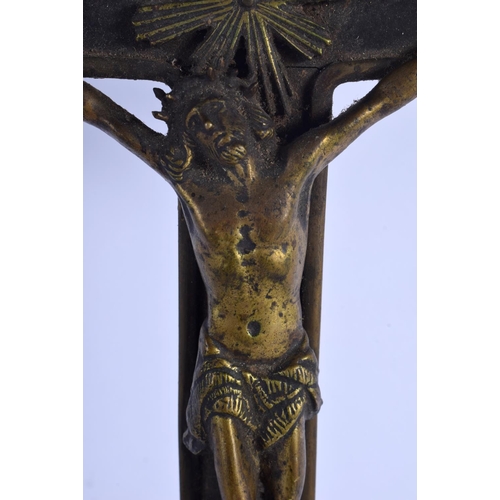 352 - A 19TH CENTURY EUROPEAN BRONZE AND WOOD CORPUS CHRISTI overlaid with skulls. 45 cm x 17 cm.