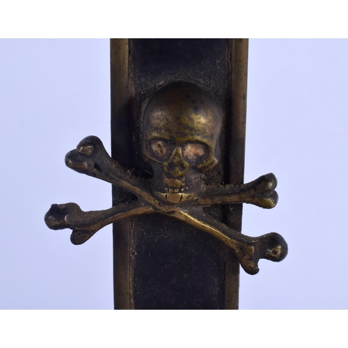 352 - A 19TH CENTURY EUROPEAN BRONZE AND WOOD CORPUS CHRISTI overlaid with skulls. 45 cm x 17 cm.