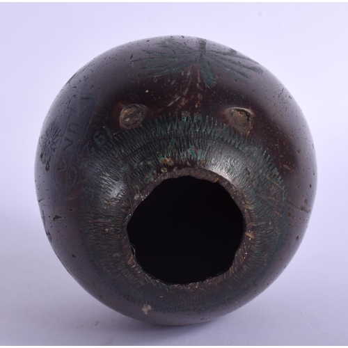 354 - AN EARLY 20TH CENTURY INDIAN CARVED PUNA COCONUT SHELL decorated with figures. 12.5 cm x 9 cm.