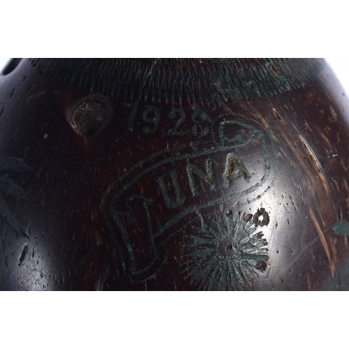 354 - AN EARLY 20TH CENTURY INDIAN CARVED PUNA COCONUT SHELL decorated with figures. 12.5 cm x 9 cm.