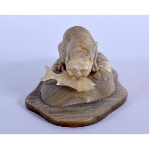 359 - A VERY UNUSUAL EARLY 20TH CENTURY NORTH AMERICAN CARVED HORN FIGURE possibly Inuit, formed with a sa... 