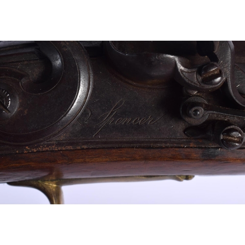 420 - AN ANTIQUE FLINT LOCK PISTOL by Spencer. 38 cm wide.