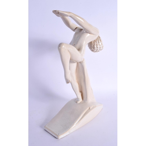 423 - AN ART DECO EVERSHED PAINTED POTTERY ADVERTISING FIGURE. 30 cm x 17 cm.