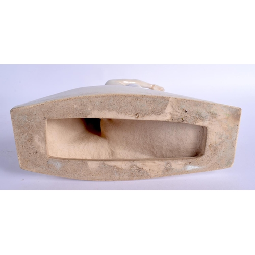 423 - AN ART DECO EVERSHED PAINTED POTTERY ADVERTISING FIGURE. 30 cm x 17 cm.