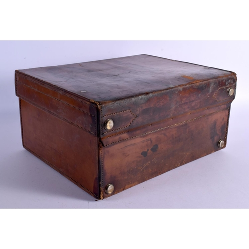 428 - AN ANTIQUE LEATHER CASED TRAVELLING SILVER VANITY CASE with fitted interior. 42 cm x 32 cm x 22 cm.