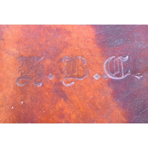 428 - AN ANTIQUE LEATHER CASED TRAVELLING SILVER VANITY CASE with fitted interior. 42 cm x 32 cm x 22 cm.