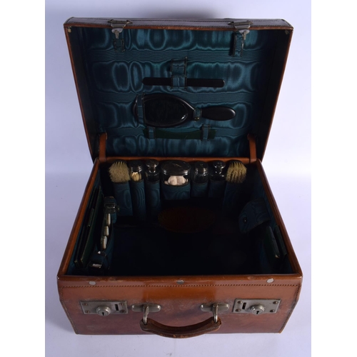 428 - AN ANTIQUE LEATHER CASED TRAVELLING SILVER VANITY CASE with fitted interior. 42 cm x 32 cm x 22 cm.