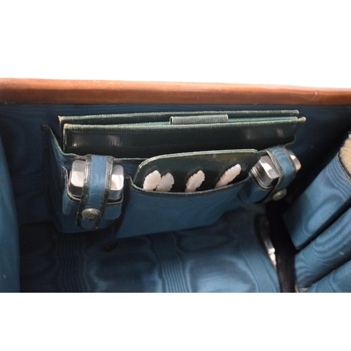 428 - AN ANTIQUE LEATHER CASED TRAVELLING SILVER VANITY CASE with fitted interior. 42 cm x 32 cm x 22 cm.