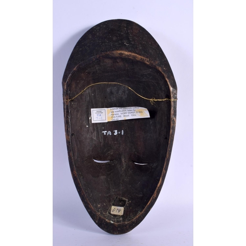 432 - AN AFRICAN TRIBAL GURO MASK with elaborate coiffeur. 34 cm x 16 cm. Provenance: Ex Neatham Mill Coll... 