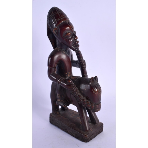 435 - AN AFRICAN TRIBAL YORUBA EQUESTRIAN FIGURE. 22 cm x 8 cm.