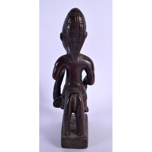 435 - AN AFRICAN TRIBAL YORUBA EQUESTRIAN FIGURE. 22 cm x 8 cm.