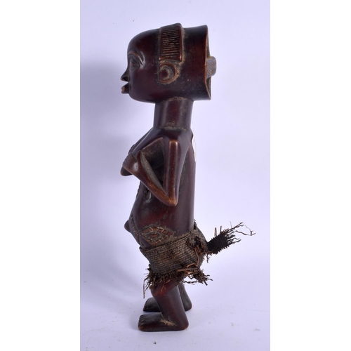 437 - AN AFRICAN TRIBAL LUBA FEMALE FIGURE modelled clutching her breasts. 27 cm high.