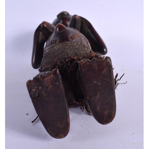 437 - AN AFRICAN TRIBAL LUBA FEMALE FIGURE modelled clutching her breasts. 27 cm high.