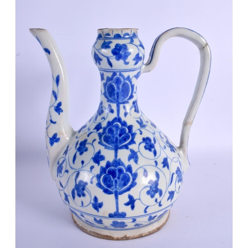 58 - A TURKISH OTTOMAN IZNIK WINE JUG painted with flowers. 23 cm x 16 cm.