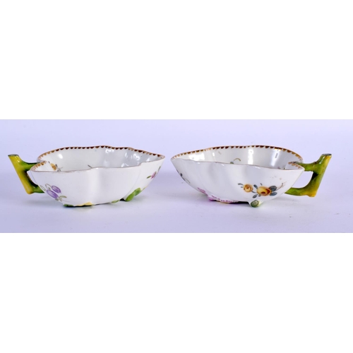 71 - A PAIR OF 19TH CENTURY EUROPEAN PORCELAIN LEAF SHAPED DISHES painted with flowers. 10 cm x 6 cm.