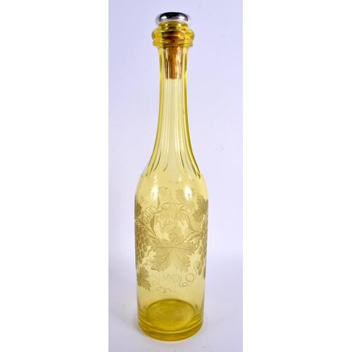 75 - AN EARLY 20TH CENTURY SILVER TOPPED YELLOW GLASS DECANTER decorated with berries. 33 cm high.
