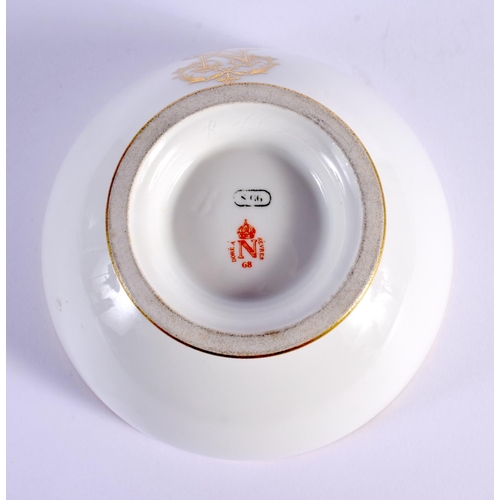 82 - A FRENCH NAPOLEON III SEVRES PORCELAIN BOWL with gilt monogram. 14 cm diameter.