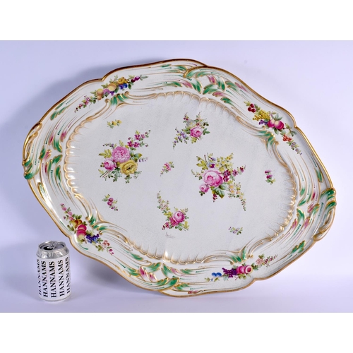 87 - A LARGE 19TH CENTURY CONTINENTAL TIN GLAZES PORCELAIN DISH painted with flowers. 60 cm x 38 cm.