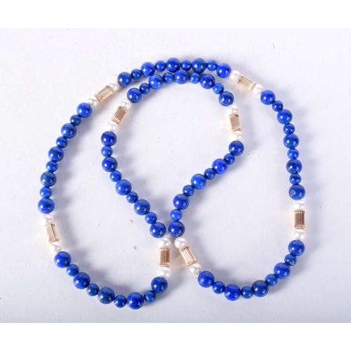 1409 - A STRING OF LAPIS AND PEARL BEADS.  Largest bead 7.7mm, weight 48g