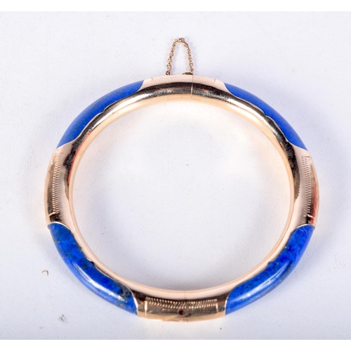 1413 - A 14CT GOLD AND LAPIS BANGLE.  Stamped 14K, 5.7cm internal diameter, weight 23.1g