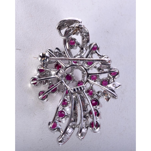1414 - AN 18CT GOLD, DIAMOND AND RUBY BROOCH.  Stamped 18K, 3.6cm x 2.6cm, weight 9g