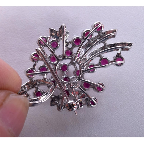 1414 - AN 18CT GOLD, DIAMOND AND RUBY BROOCH.  Stamped 18K, 3.6cm x 2.6cm, weight 9g