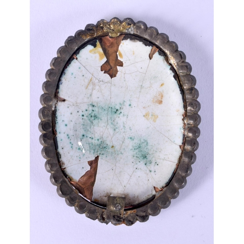 21 - A 17TH/18TH CENTURY CONTINENTAL JEWELLED ENAMEL ICON depicting a saint. 7 cm x 4.5 cm.