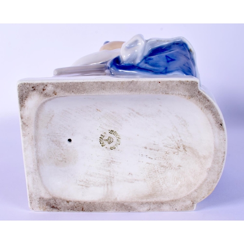 23 - A ROYAL COPENHAGEN FIGURE OF A SEATED FEMALE modelled holding a duck. 23 cm high.