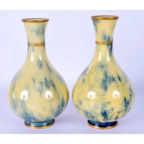 29 - A PAIR OF LATE 19TH CENTURY SEVRES PORCELAIN VASES with gilt banding. 16 cm high.
