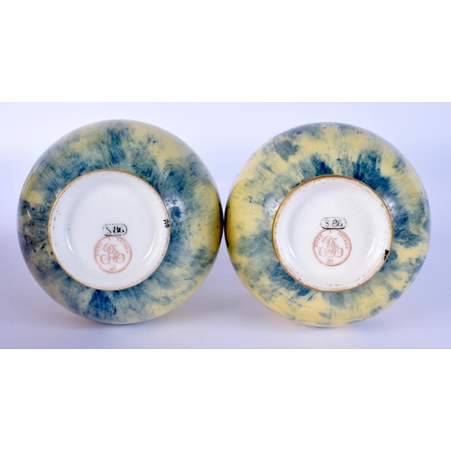 29 - A PAIR OF LATE 19TH CENTURY SEVRES PORCELAIN VASES with gilt banding. 16 cm high.