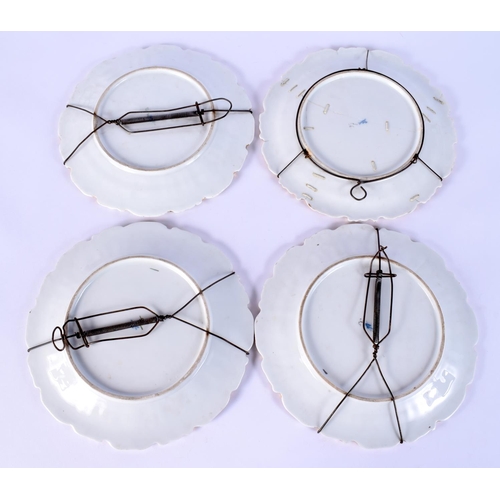 33 - A SET OF FOUR EARLY 20TH CENTURY GERMAN PORCELAIN PLATES painted with flowers. 18 cm wide. (4)