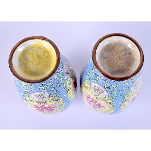 39 - A FINE PAIR OF CHINESE QING DYNASTY CANTON ENAMEL VASES painted with bold foliage and vines. 14 cm h... 