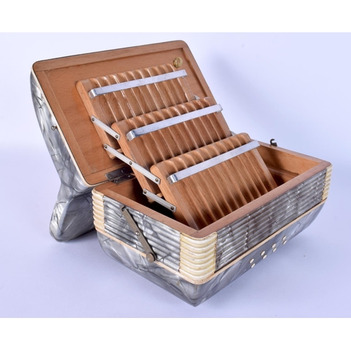 40 - A RARE 1950S ITALIAN ACCORDION CIGARETTE DISPENSER with extending body. 17 cm x 17 cm.