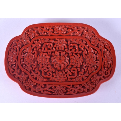 52 - TWO EARLY 20TH CENTURY CHINESE RED LACQUER ITEMS including a jade pendant. Largest 15 cm wide. (3)