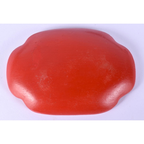 52 - TWO EARLY 20TH CENTURY CHINESE RED LACQUER ITEMS including a jade pendant. Largest 15 cm wide. (3)